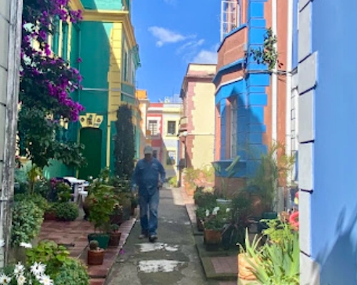 La Candelaria neighborhood with colorful colonial buildings and cobblestone streets in Bogotá.