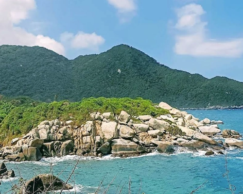 Parque Nacional Natural Tayrona tropical beach, rainforest trails, and Caribbean coastline in Colombia.