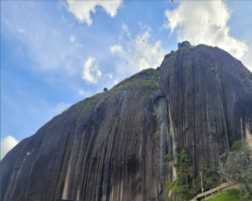 Guatape Rock viewpoint overlooking lakes, islands, and green hills in Antioquia, Colombia.